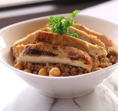 Mediterranean grill chicken with rice topped with garlic sauce